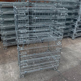 Large used collapsible stackable mesh pallet cages.