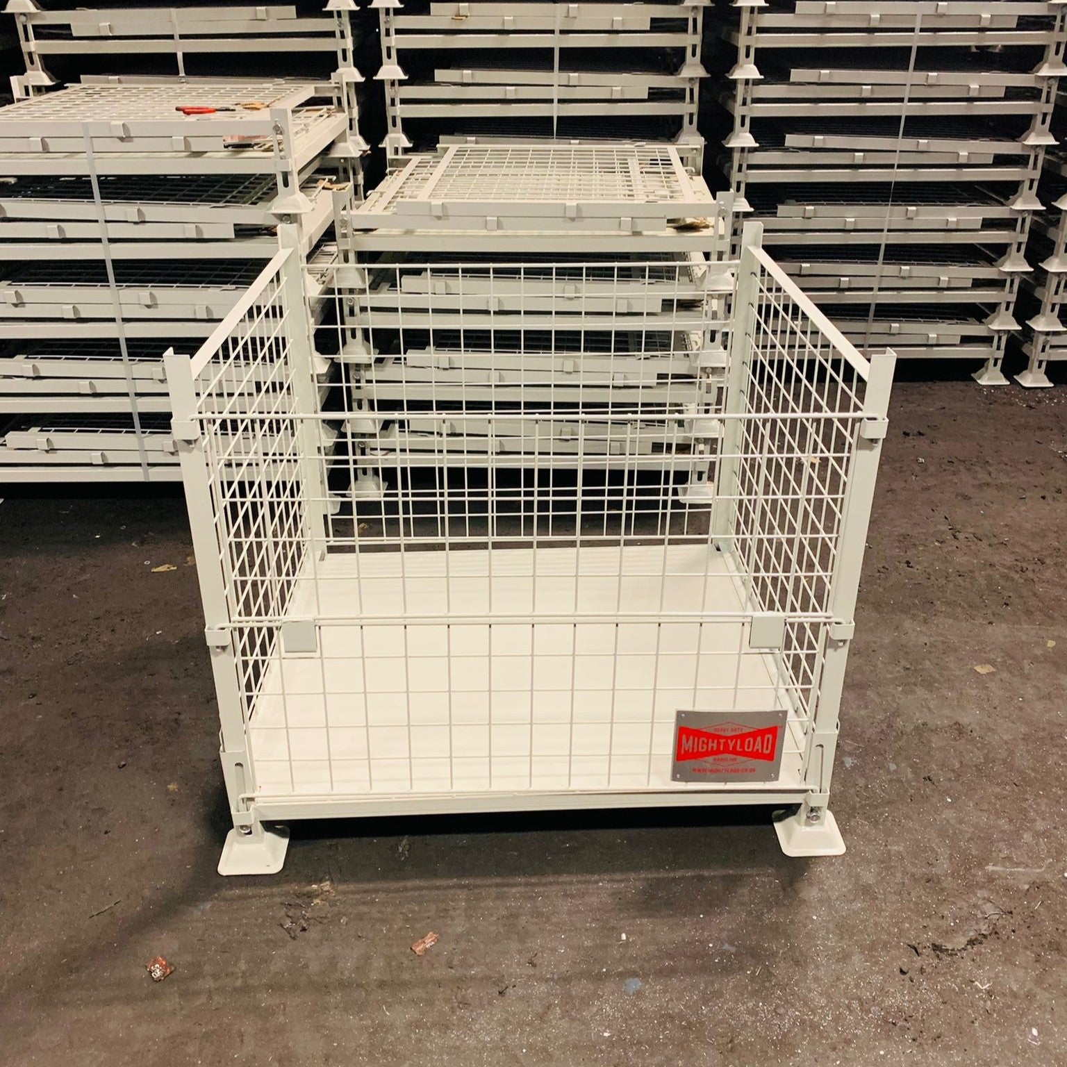 Collapsible MightyLoad pallet storage cage with powder white coating for heavy duty storage.