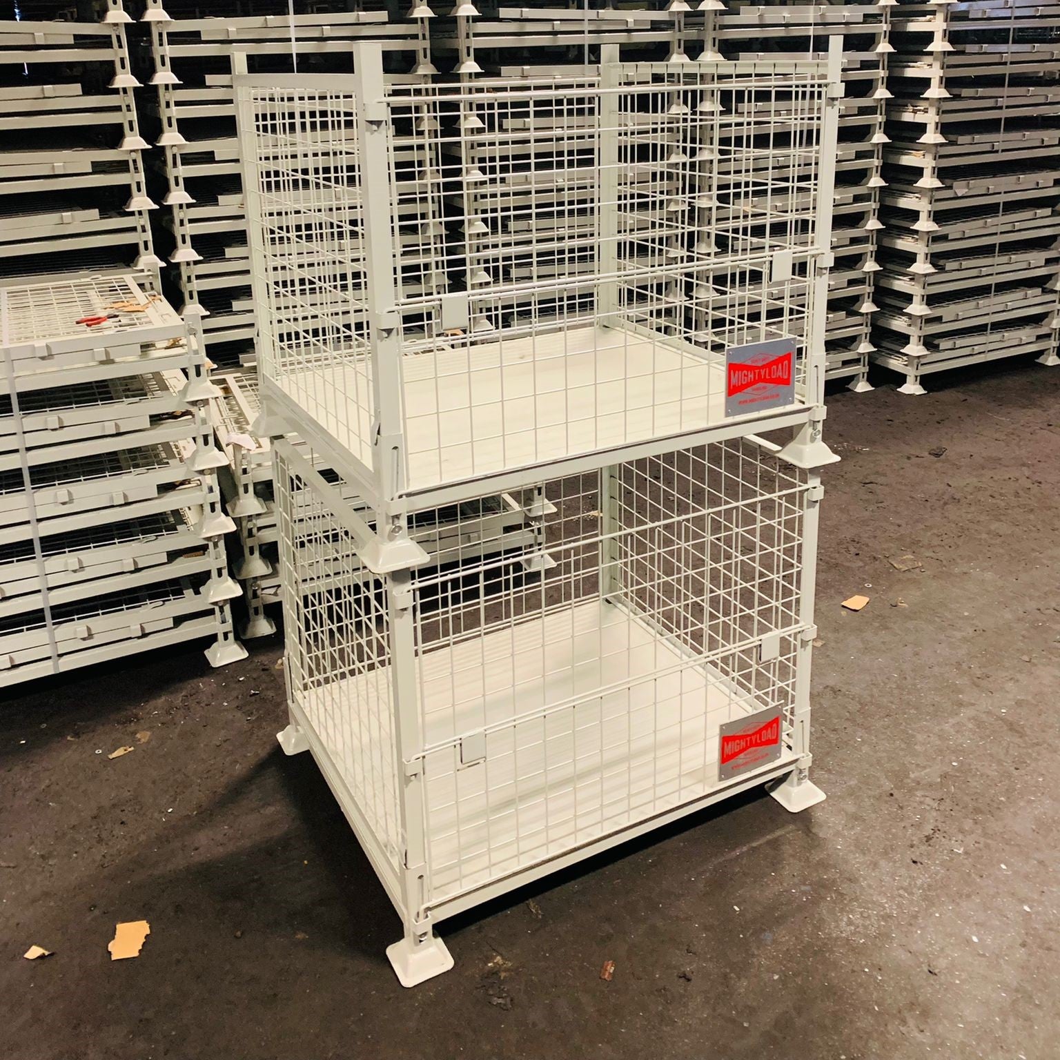 Photo shows MightyLoad heavy duty pallet cages stacked on top of each other. This pallet cage can be stacked to 4 units high.