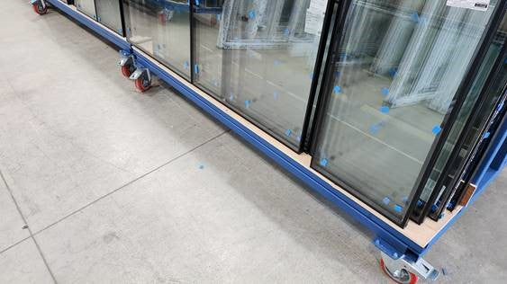 A Frame Stillage Trolleys being used to store and move glazing units around the factory
