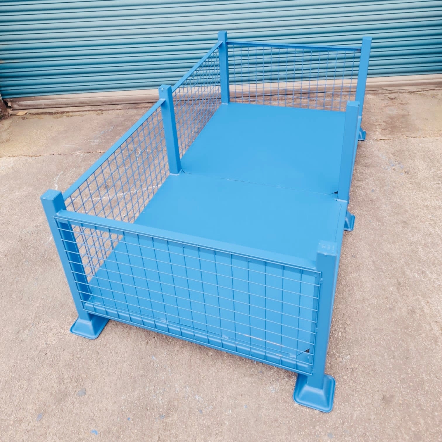 Large heavy duty stillage with mesh sides and open front section for easy loading of goods