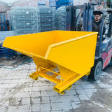 Forklift truck lifting a self tipping skip