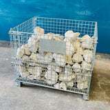 Heavy duty pallet cage loaded with quarry stone